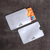 A set of ten clear plastic RFID blocking card sleeves is displayed on a dark surface.
