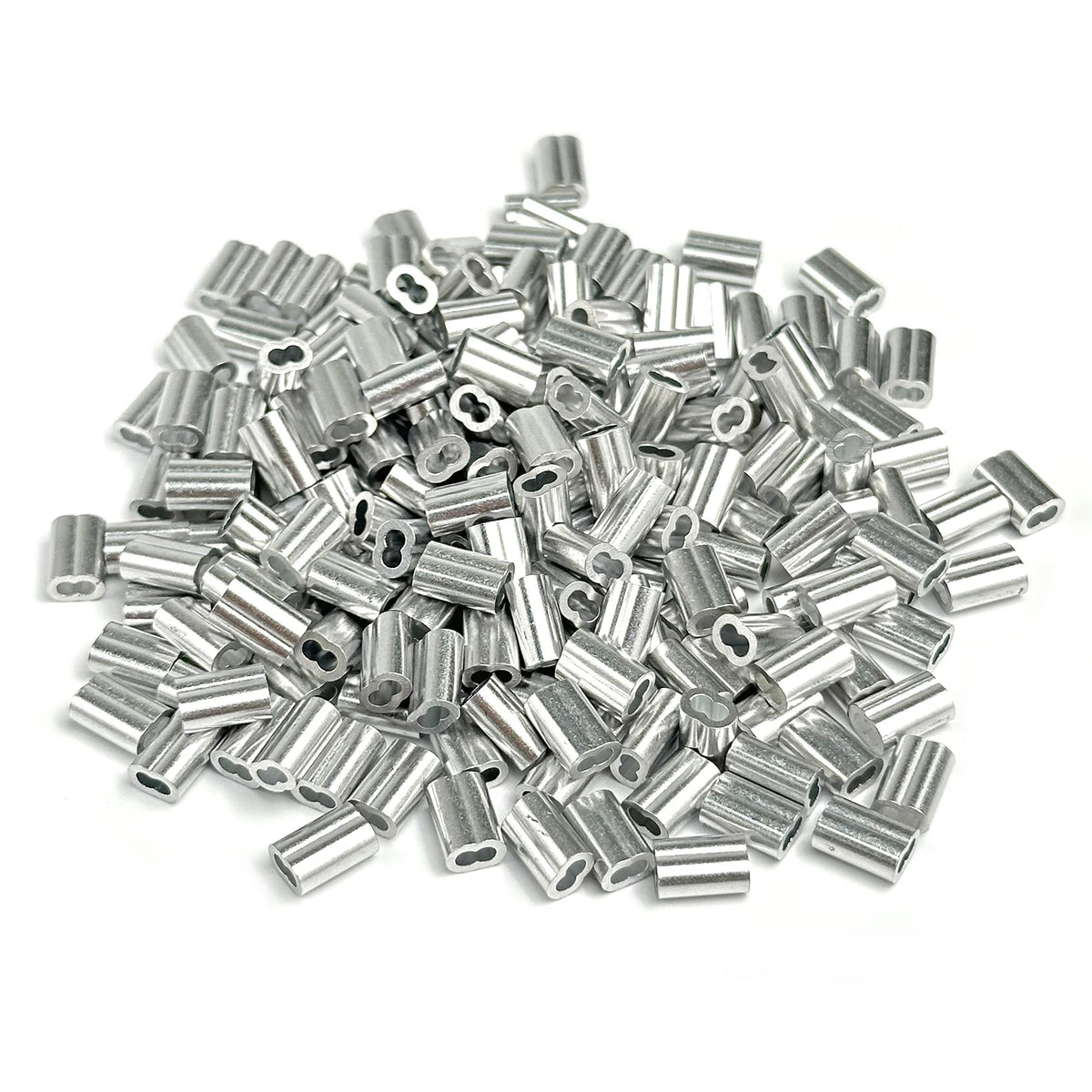 A pile of silver aluminum double barrel crimp sleeves for wire rope.