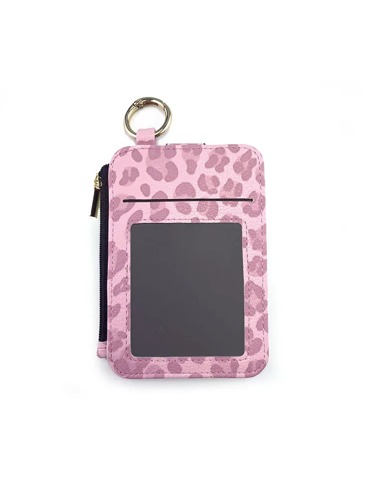 A pink leopard print PU leather card holder with a coin pocket and keychain attached.