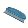 A blue pet hair removal brush with a silver blade and a handle, shown in profile.