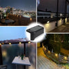 A set of solar powered LED step lights illuminating outdoor stairs and paths at night.