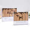 Two boxes of wooden train track expansion packs showing various curved and straight pieces for model trains.