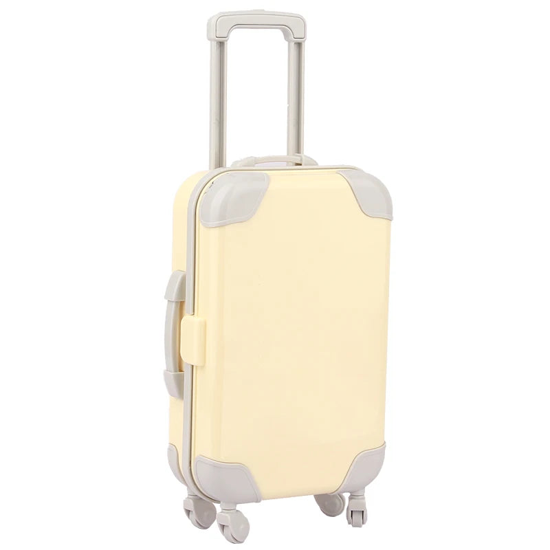 A light cream colored doll travel suitcase with a silver handle and gray accents.