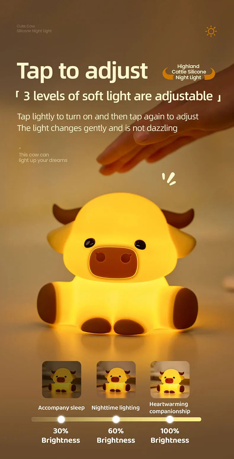 A yellow silicone night light shaped like a Highland cow, showing three adjustable brightness levels.