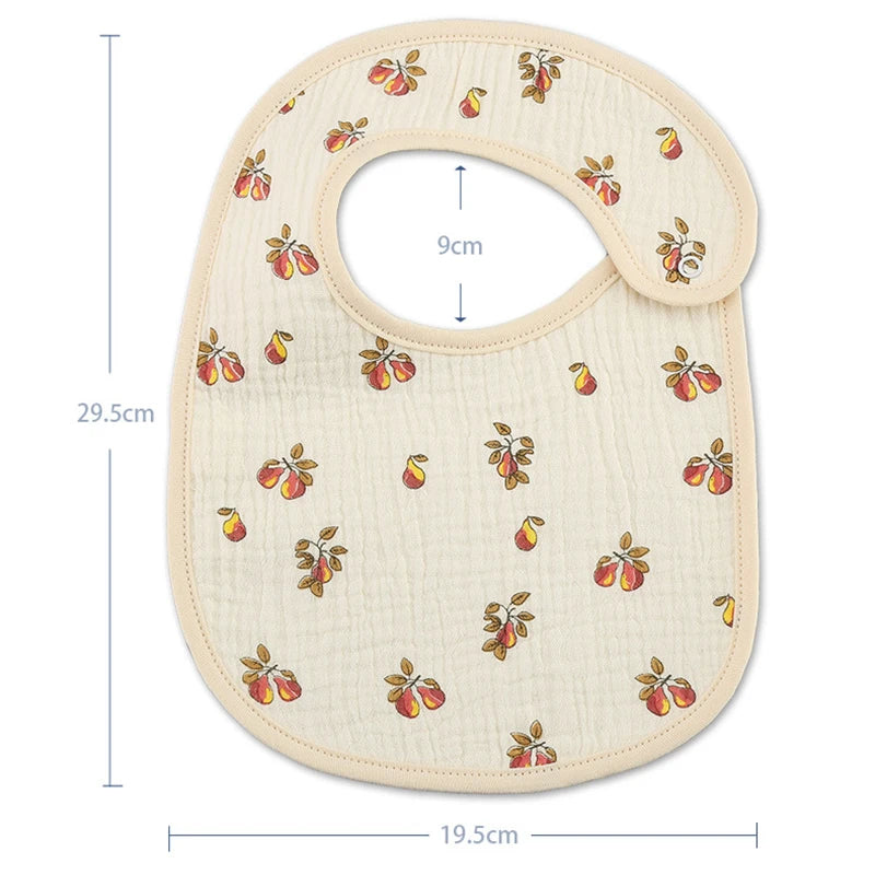 A beige baby cotton gauze bib with a rounded shape and floral pattern, shown with dimensions.