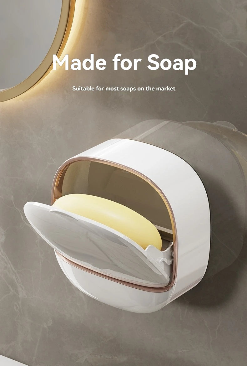 A white waterproof hanging soap holder with a clear top is mounted on a gray wall.