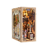 A boxed DIY book nook kit featuring a detailed bookstore scene with built-in LED lighting.