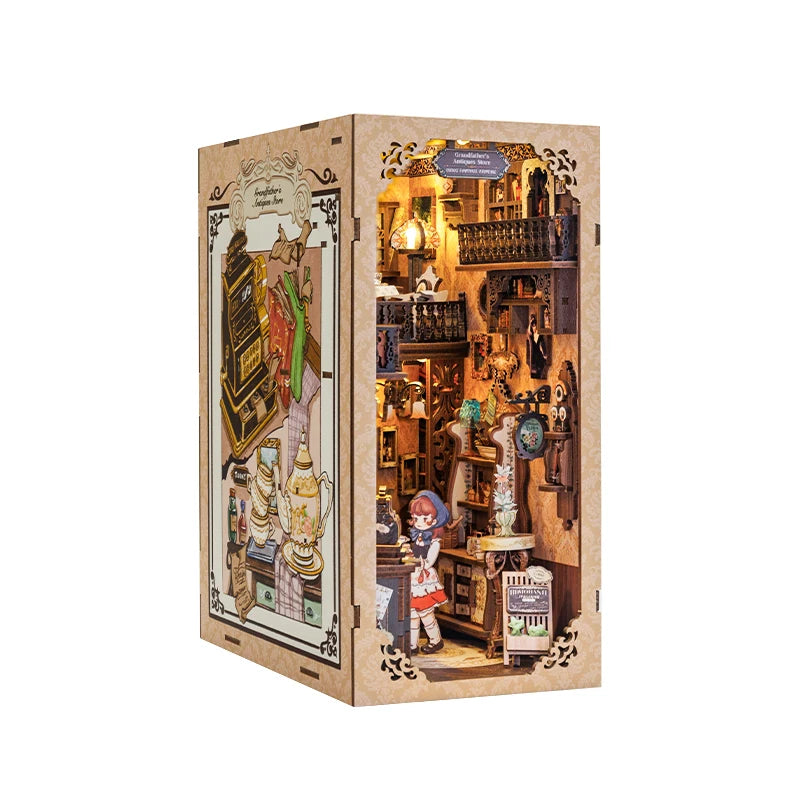 A boxed DIY book nook kit featuring a detailed bookstore scene with built-in LED lighting.