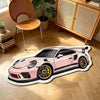 A pink sports car shaped non-slip play rug for kids' bedrooms on a wooden floor.