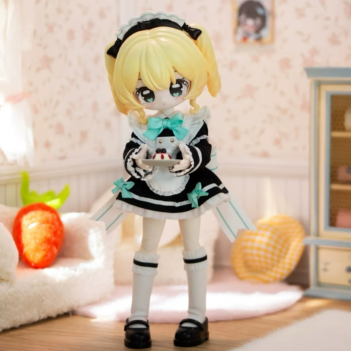 A blonde Articulated BJD collectible figurine in a black and white outfit with a light blue bow and ruffled skirt.