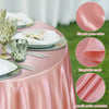 Pink satin tablecloth draped on a round table with silverware and glassware, showing the smooth fabric texture.