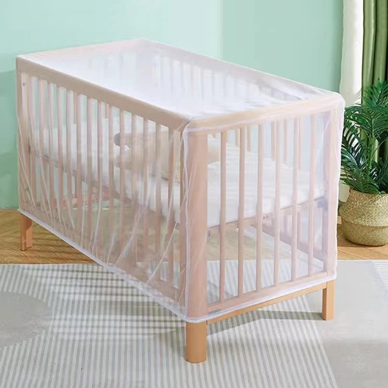 A clear, breathable mosquito net crib for a baby, featuring light pink framing and netting.
