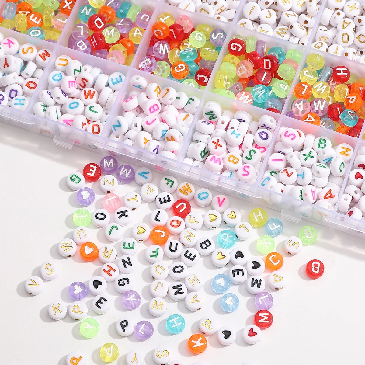 A collection of colorful acrylic letter beads in various colors and shapes arranged in a grid storage box.