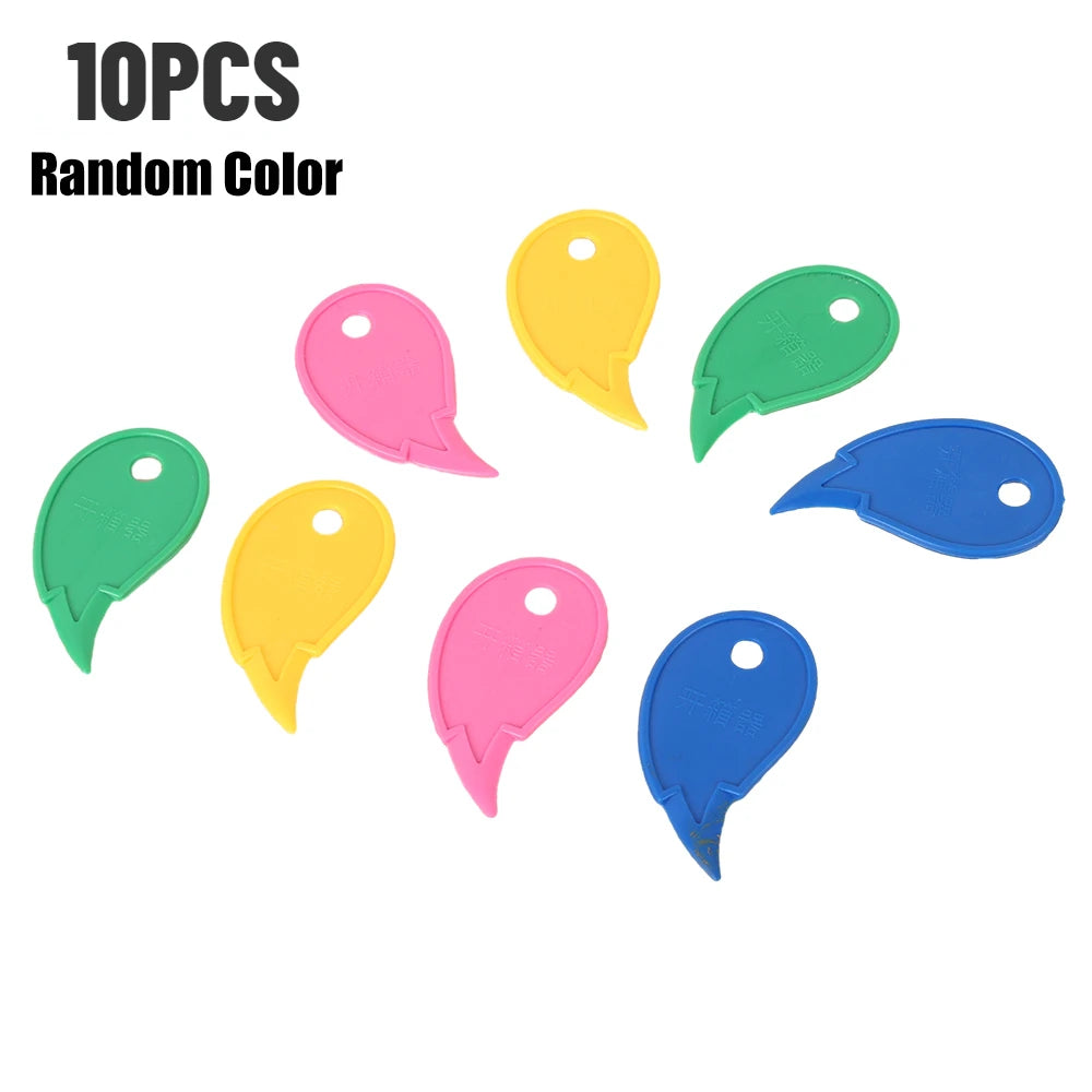 Ten random color plastic box cutters and letter openers scattered on a white background.