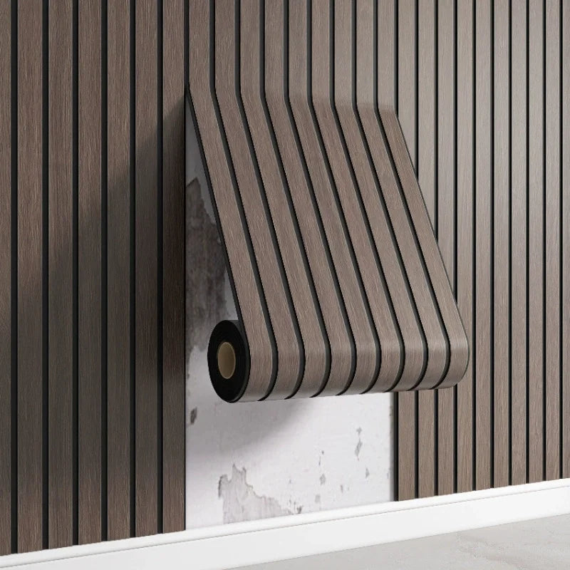 A close-up of a vertical wood slat wall panel in a natural brown tone mounted on a white shelf.