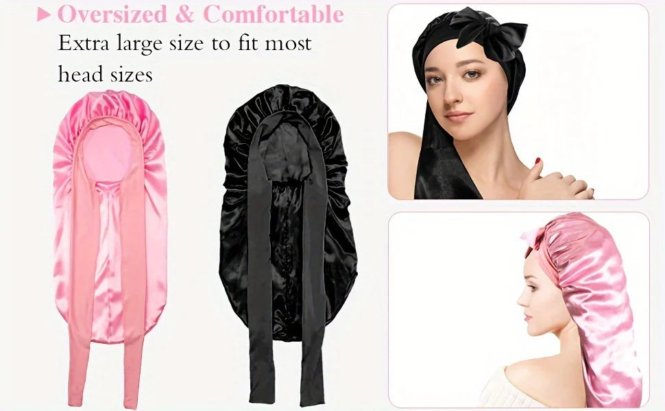 A set of oversized satin sleep bonnets in pink and black for various head sizes.