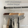 Solid wood storage clothes hanger with multiple metal hooks for hanging garments.