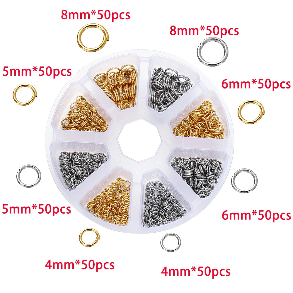 A variety of gold and silver jump rings, clasps, and crimps in different sizes are displayed in a circular plastic tray.