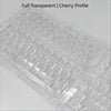 A close-up view of translucent cherry profile PC keycaps arranged in a plastic tray.