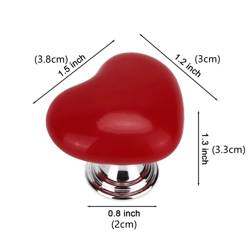 A glossy red heart-shaped toilet flush button with a chrome base.