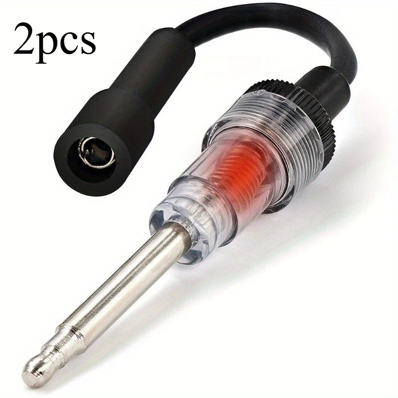 Two automotive spark plug ignition testers with diagnostic gauges and cables.