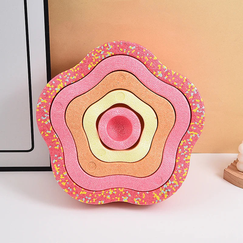 A colorful, multi-layered, flower-shaped balance stepping stone for kids' sensory and motor skills development.