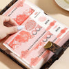 A hand is shown opening a pink and gold money organizer notebook with code protection features.