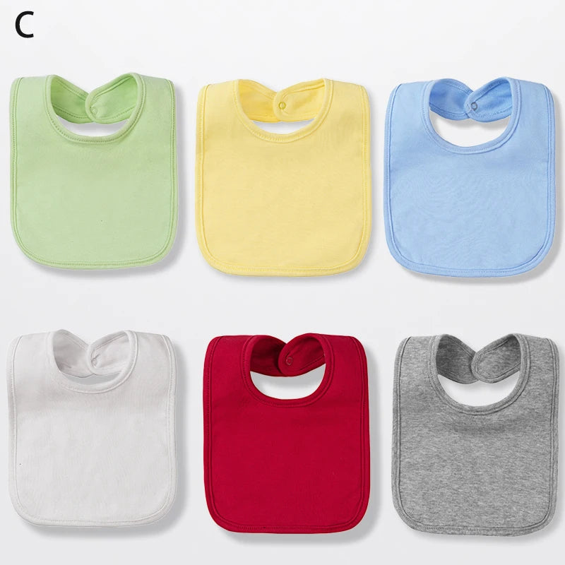 A set of six cotton bandana bibs in various colors including light green, yellow, blue, white, red, and gray.