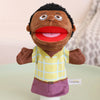 A soft plush hand puppet of a Black man with a red mouth and a yellow plaid shirt.