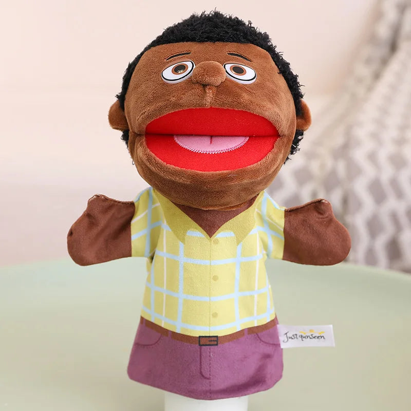 A soft plush hand puppet of a Black man with a red mouth and a yellow plaid shirt.