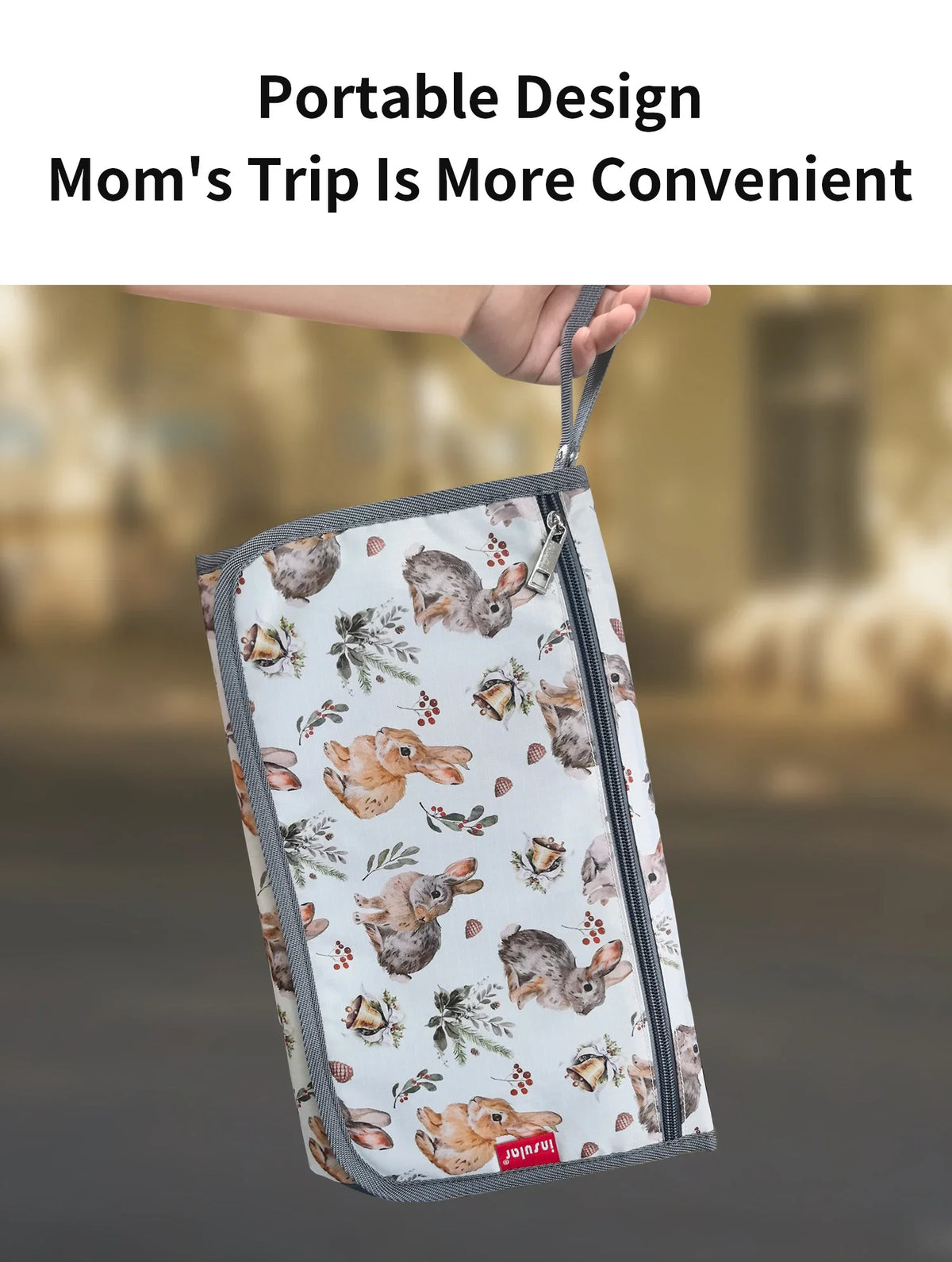 A portable design mom's travel item featuring a fabric pouch with a rabbit pattern.