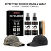 Jakehoe Hat Cleaner kit with two spray bottles and a brush shown next to a baseball cap.