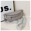 A light gray multi-pocket PU leather waist bag with a patterned strap is displayed on a white surface.