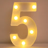 A glowing LED letter night light shaped like the number five, illuminating the letters with bright white lights.