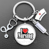 Silver keychain featuring a glass dome charm with the text I Love Nursing and a medical symbol.