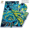 Blue and yellow African wax print fabric featuring intricate patterns and gold accents