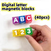 A hand holds colorful digital letter magnetic blocks including ABC and numbers 123 for building and storage.