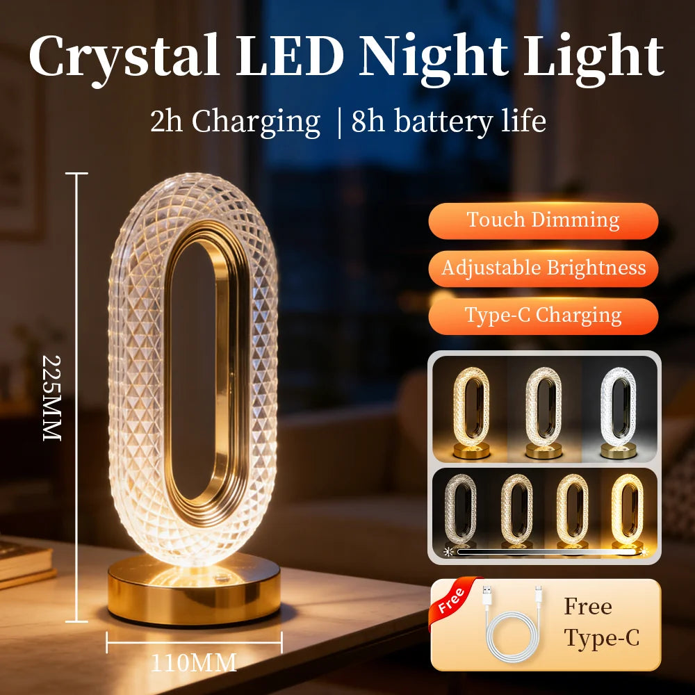 A crystal LED night light with a gold base and touch dimming features shown on a wooden surface.