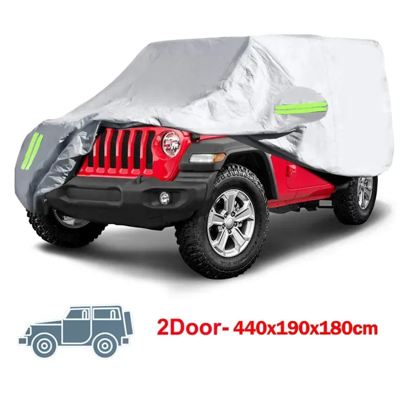 A red Jeep Wrangler is shown with a gray and white all-weather outdoor car cover installed.