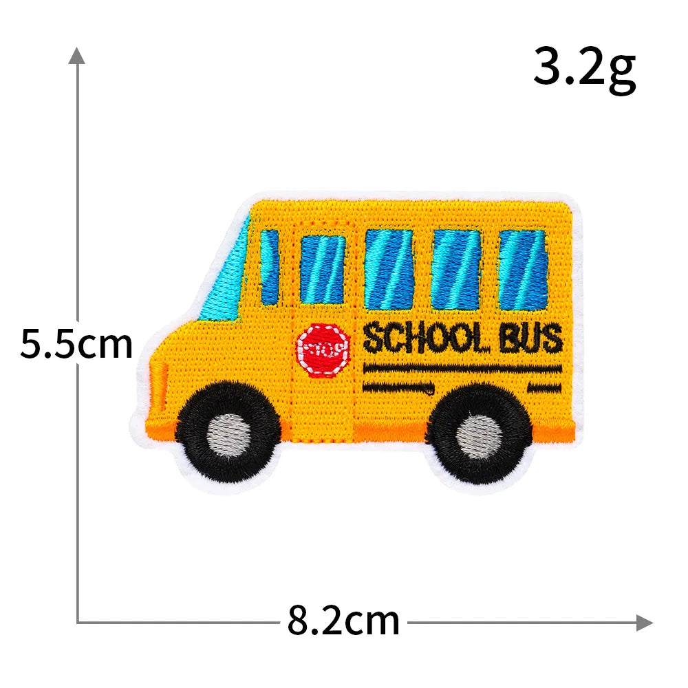 A yellow school bus iron-on patch with blue windows and the text SCHOOL BUS on it.