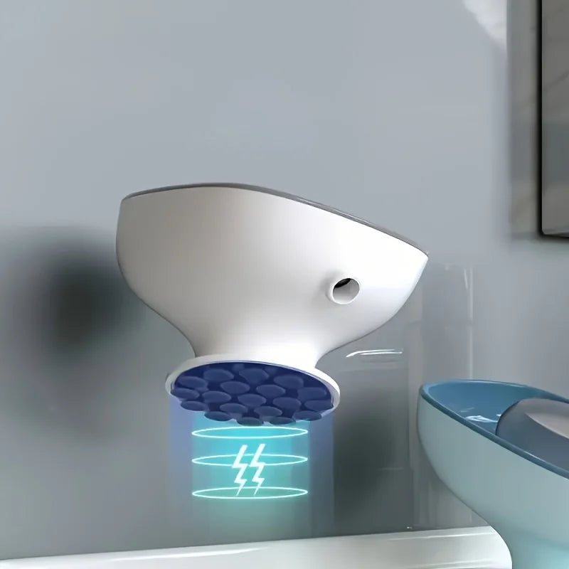 A white 2-in-1 suction cup soap dish with a blue draining tray mounted on a wall.