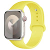 A yellow silicone sport band is shown next to an Apple Watch, highlighting the watch and strap.