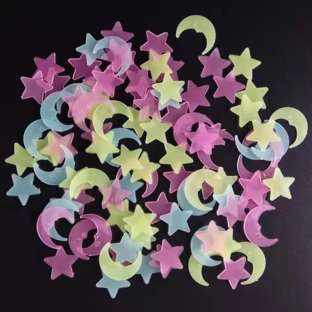 A collection of glow-in-the-dark 3D star and crescent moon stickers in various shades of pink, yellow, and blue.