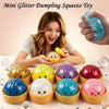 A woman holds a hand squeezing a colorful glitter dumpling squeeze toy with various colors.