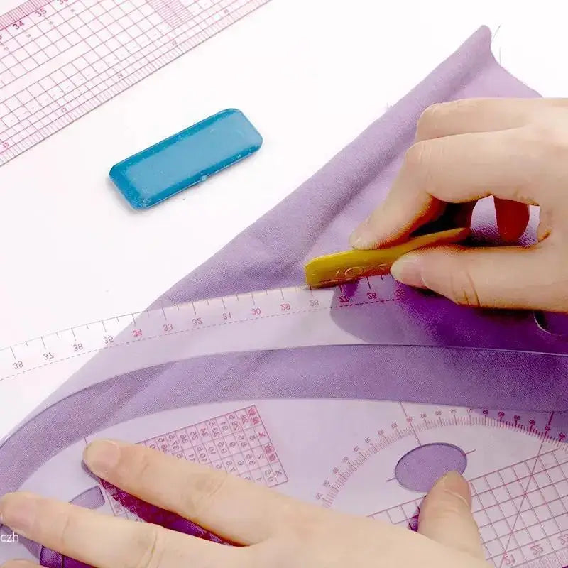 A hand is using a blue flexible French curve sewing ruler on a purple fabric, demonstrating its use for sewing.