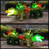 A green interactive walking T-Rex dinosaur toy with glowing orange and green lights in a natural setting.