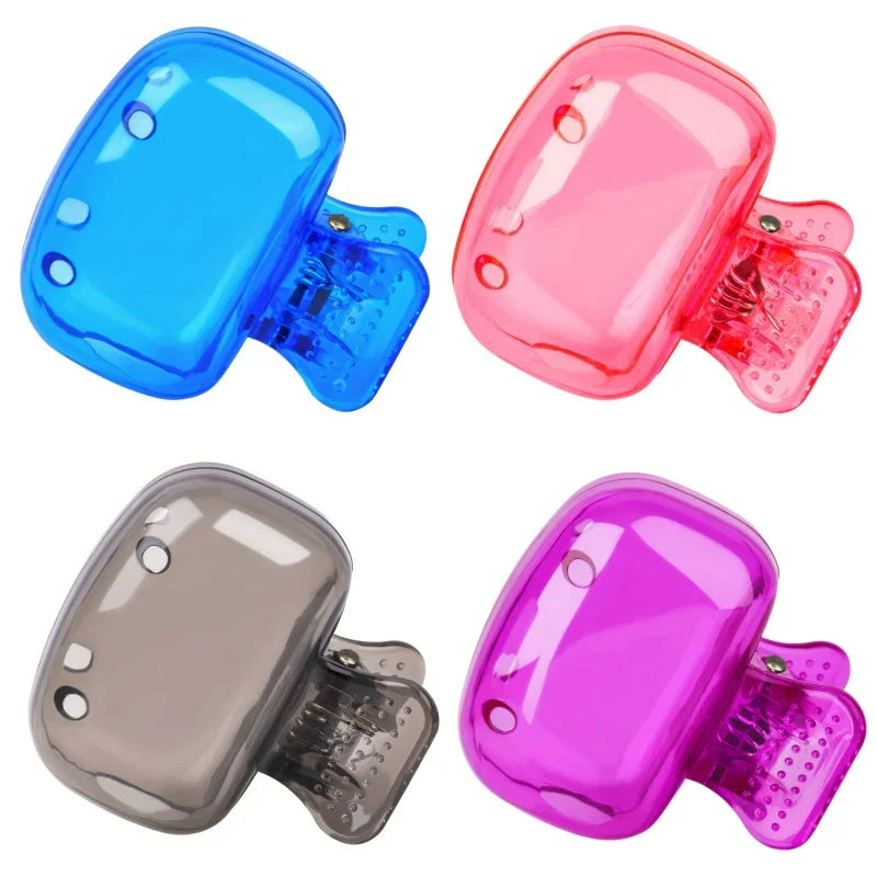 Three silicone toothbrush head covers in blue, pink, and purple shown with their clips.