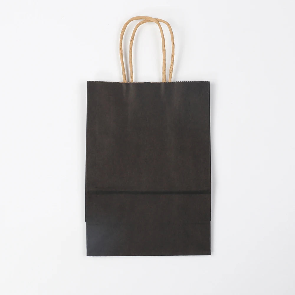 A dark brown kraft paper gift bag with natural twine handles.