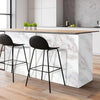 A modern kitchen counter with a white marble top and black bar stools, featuring glossy pink marble contact paper.
