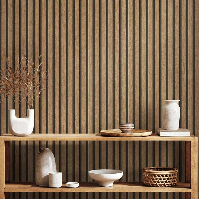 A display of ceramic and wooden decorative items against a vertical striped brown wall background.
